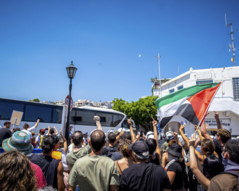 Anti-war demonstrators protest the arrival of an Israeli cruise ship on the Greek island of Crete