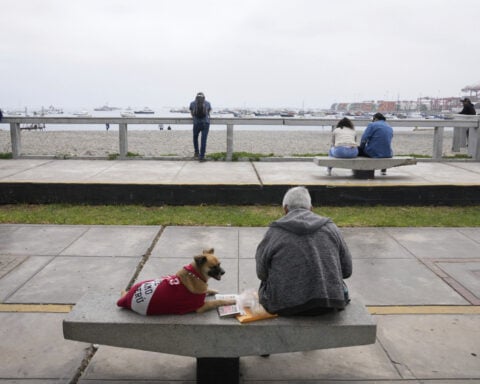 The Latest: Tsunami warnings lifted in most places