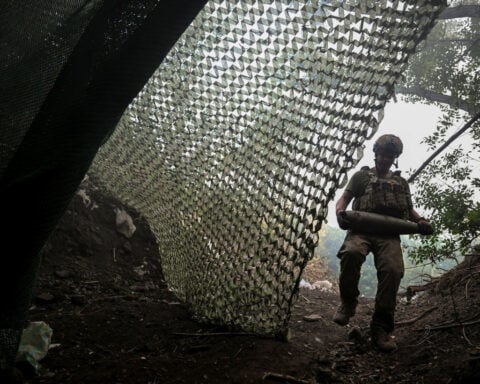 Soldiers in Ukraine battle Russian offensive as drones riddle the night sky
