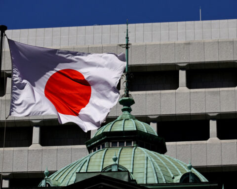 BOJ keeps rates steady, revises up inflation forecast