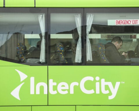 New Zealand woman arrested after 2-year-old girl found alive in suitcase stowed in bus luggage