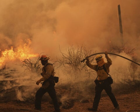 Colorado prison evacuated as growing wildfire becomes one of the largest in state history