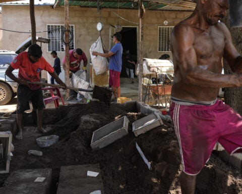 Migrants returning to Venezuela face debt and harsh living conditions