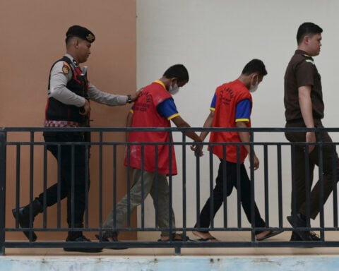 Islamic court in Indonesia sentences 2 men to public caning over sexual acts: kissing and hugging