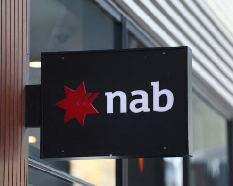 Australia business mood brightens as activity holds up