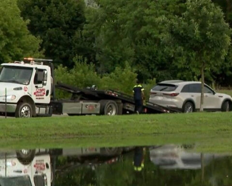 Tow companies busy moving cars to higher ground after historic flooding