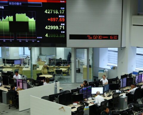 Asian shares rise, dollar defensive after mild inflation data
