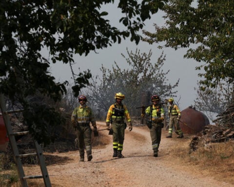 Volunteer firefighter dies as wildfires rage across heat-stricken Spain