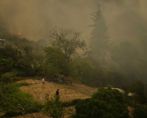 At least 3 dead and thousands displaced as wildfires rage across southern Europe