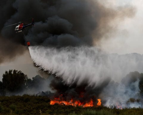 Wildfires fanned by heatwave and strong winds rage across Europe