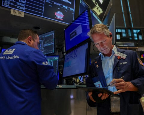 Wall Street ends flat, but S&P hits another closing high as rate-cut bets waver
