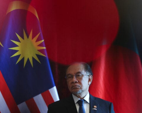 Malaysia PM calls for probe into syringe attack on ex-minister's son 