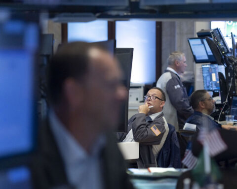 Dow hovers near record territory as Wall Street gets rate-cut fever