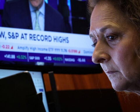 Dow briefly hits record high on UnitedHealth's gains; data in focus