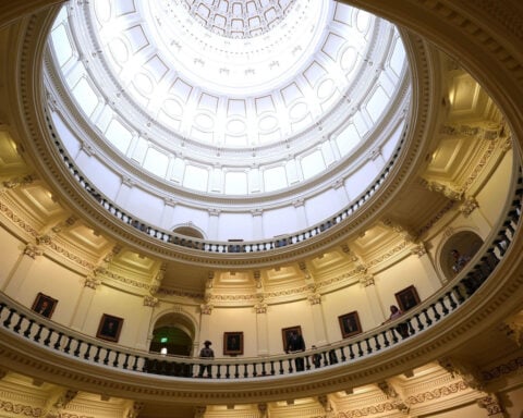 Some Texas Democrats rip up agreements to leave House floor under police escort and will spend night in chamber in protest