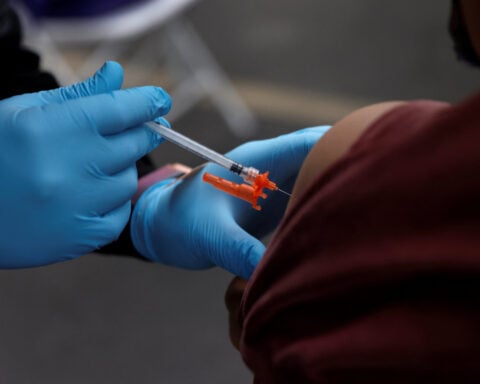 US insurers likely to cover updated COVID shots this year, industry sources say