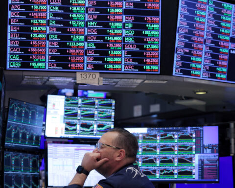 Wall Street retreats from record closing highs as economic worries mount
