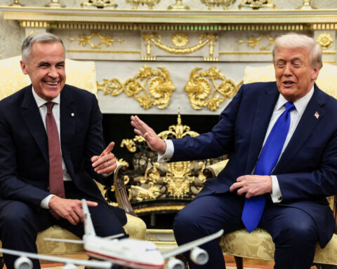 A red tie and laughs about annexation: How Canada’s prime minister is trying to get in Trump’s good graces