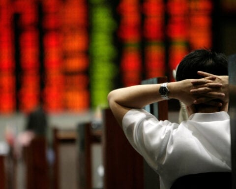 Asia stocks swept up in AI euphoria, oil slips on Gaza ceasefire deal