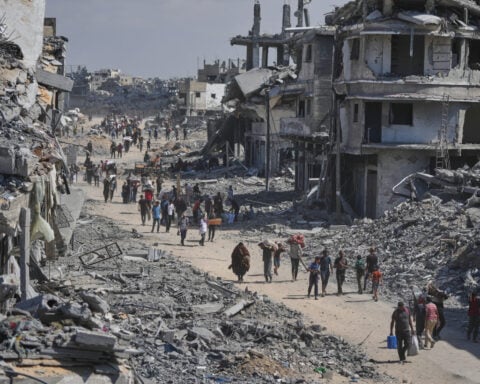 The Latest: Tens of thousands of Palestinians in Gaza return north as ceasefire takes effect