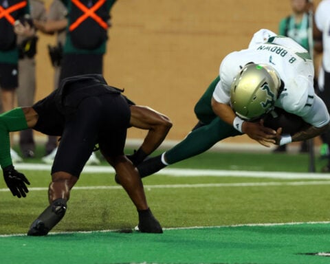 No. 24 South Florida scores 4 TDs in a 3 1/2-minute span and hands North Texas its 1st loss