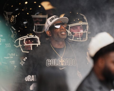 Colorado fans storm field after win over No. 22 Iowa State, Deion Sanders loves it but fine may loom