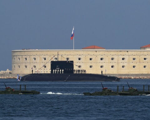 NATO chief mocks 'broken' Russian submarine as Moscow denies malfunction