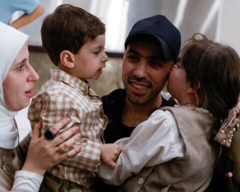 Palestinians cheer as freed prisoners begin to arrive home under ceasefire deal