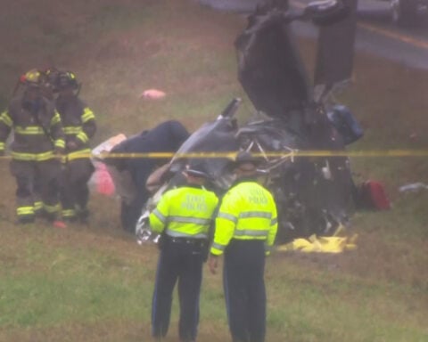 Plane crashes onto a Massachusetts highway, killing 2 on board and hurting 1 motorist