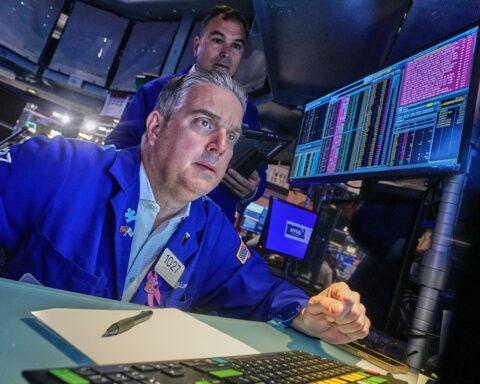 Stocks wobble as trade tensions between the US and China escalate