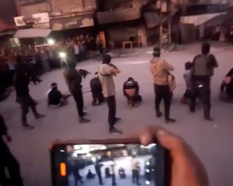 Masked Hamas fighters seen executing men in Gaza City as the group fights with rival powers