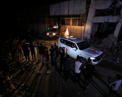 Hamas hands over hostage bodies after Israel threatens aid cut