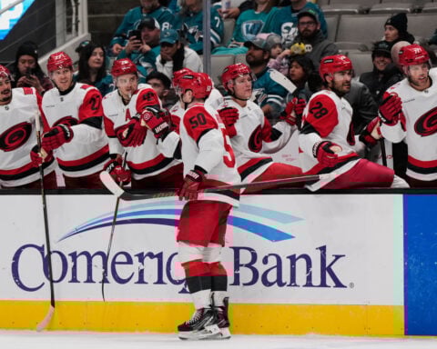 Carrier, Robinson score late in 2nd period and Hurricanes beat Sharks 5-1 to improve to 3-0