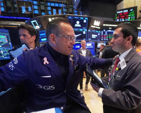 Most US stocks rise after swinging through another erratic day
