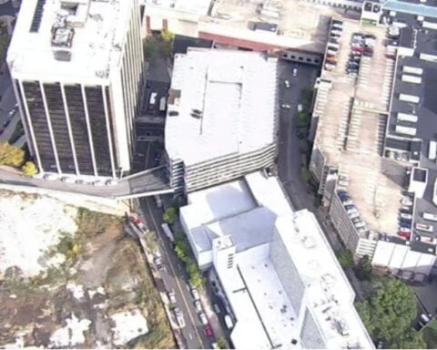 Parking garage partially collapses onto cars inside