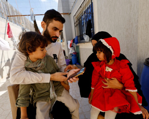 Freed Gaza photographer overjoyed to find family alive after being told in Israeli jail they were dead
