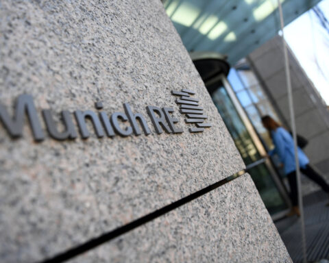 German insurer Munich Re warns of riot risk in slower-growth Europe