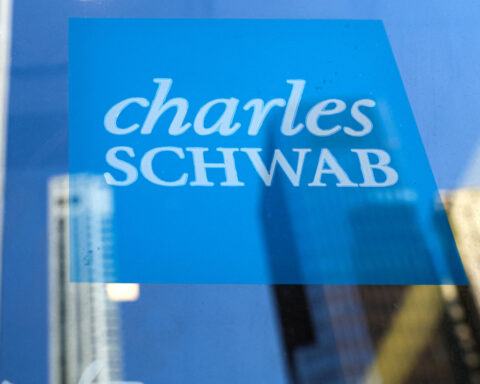 US broker Schwab clinches record profit on client assets, trading strength