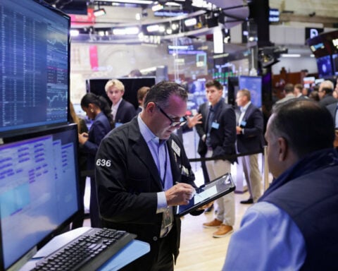 US stocks pulled lower by financials; gold hits record highs