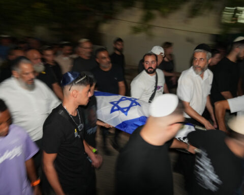 The Latest: Israel identifies remains of 2 more hostages