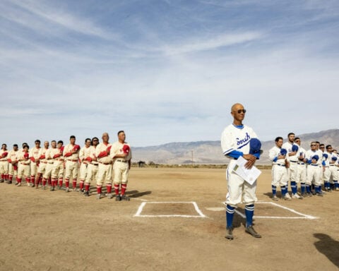 Baseball returns to a Japanese American detention camp after a historic ball field was restored