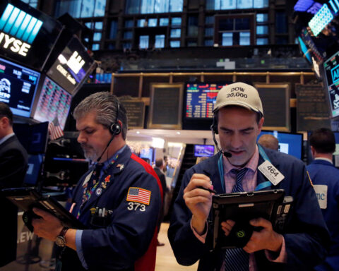US stocks end higher, Treasury yields rise on easing credit, trade worries