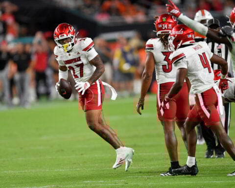 Miami's perfect season hopes are dashed as Beck throws 4 interceptions in loss to Louisville