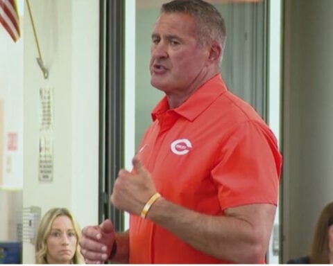 Football coach delivers emotional apology after son accused of filming middle school boys undressing, officials say