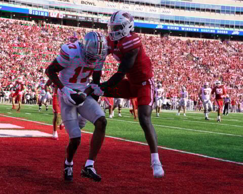 Sayin throws 4 TD passes as No. 1 Ohio State throttles Wisconsin 34-0