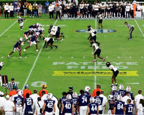 All about the logo: Schools adding corporate gridiron ads to level revenue-sharing playing field