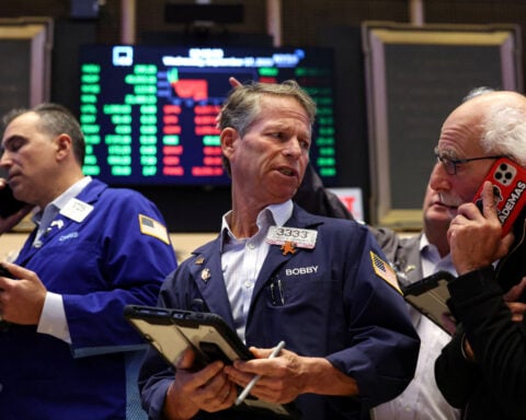 Trading Day: Stocks' momentum fades, gold plunges