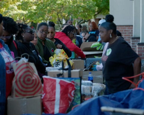 Federal workers form line down the block for food pantry as shutdown hits third-week mark