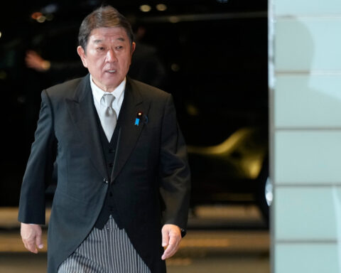 Japan says it plans to tell Trump it will build up military and upgrade security strategy