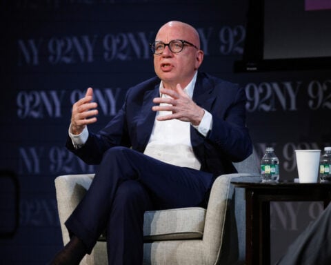 Author Michael Wolff sues Melania Trump, saying she threatened $1B suit over Epstein-related claims
